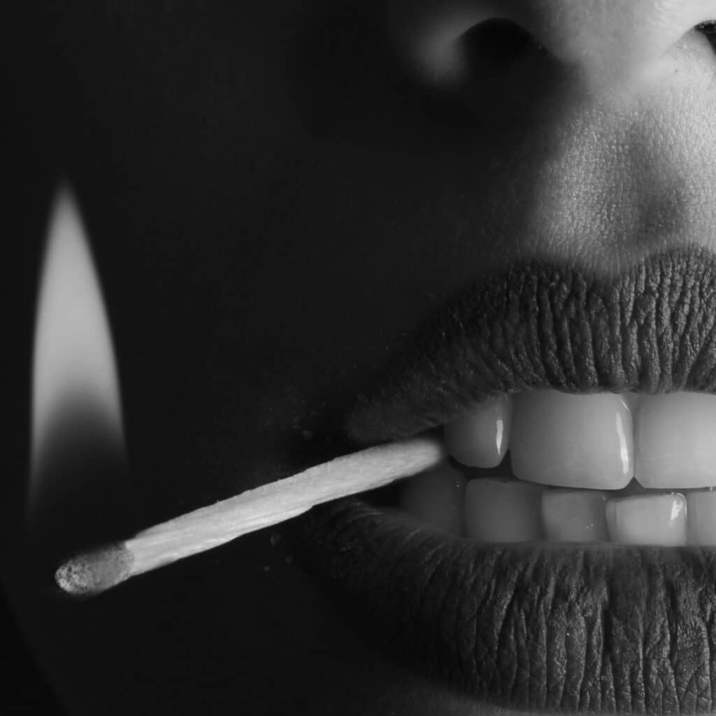 elf beauty marketing woman mouth holding fire